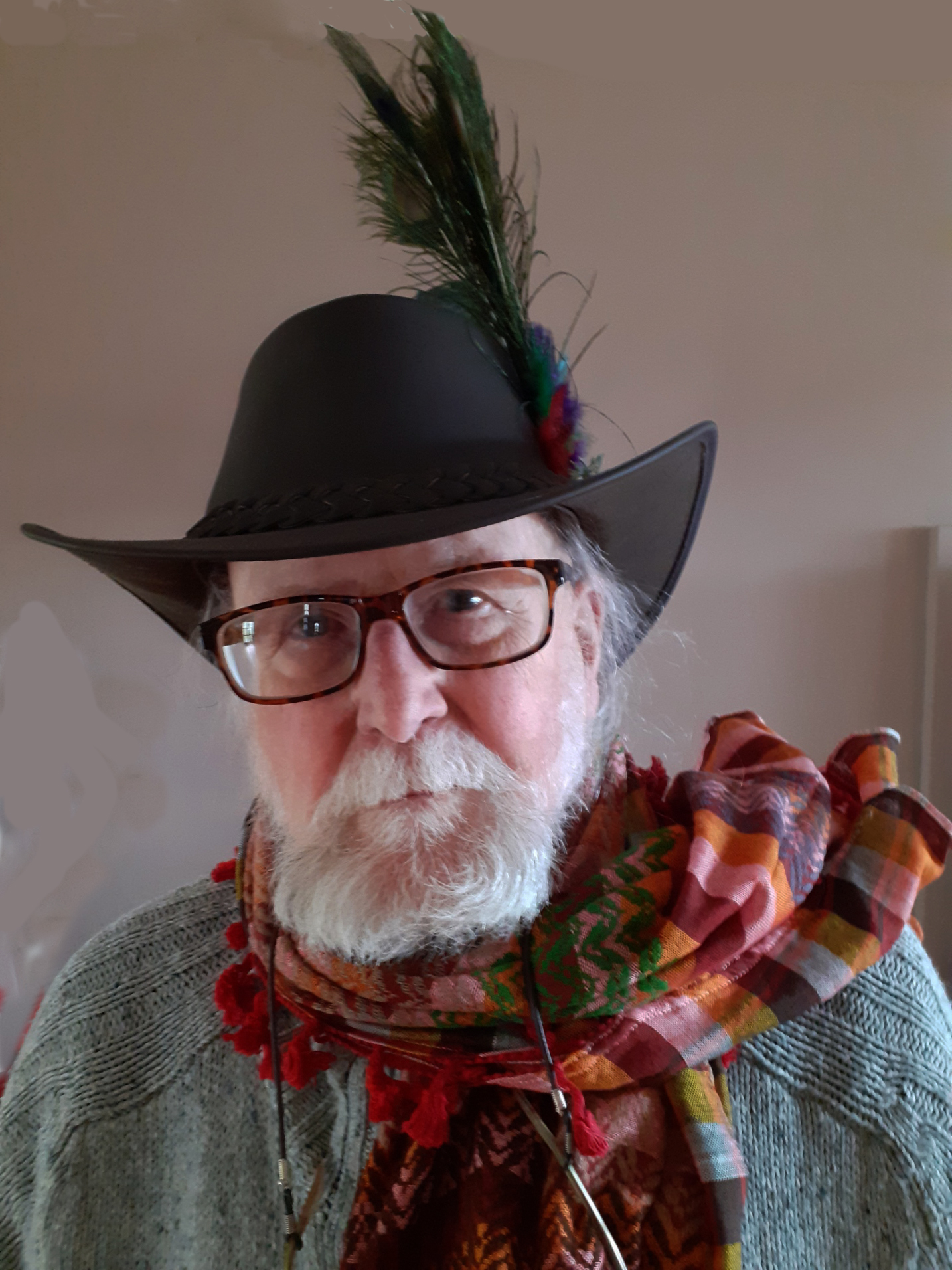 photo of Jeff Merrifield, an older man with a beard, wearing a hat with a feather in